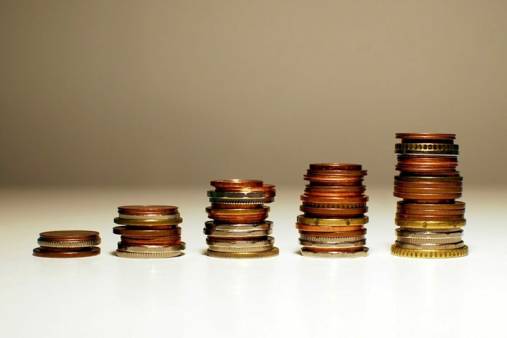 Stacks of coins increasing in height from left to right.